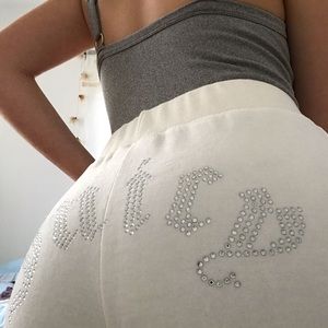 A pair of Juicy Couture x Forever 21 white velour flare pants